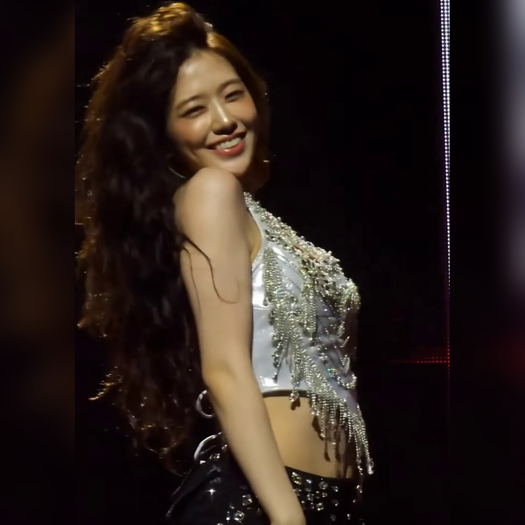 IVE An Yujin Slightly Bends to Show Off Silver Sparkly Lingerie Look with Cleavage Peeking Out
