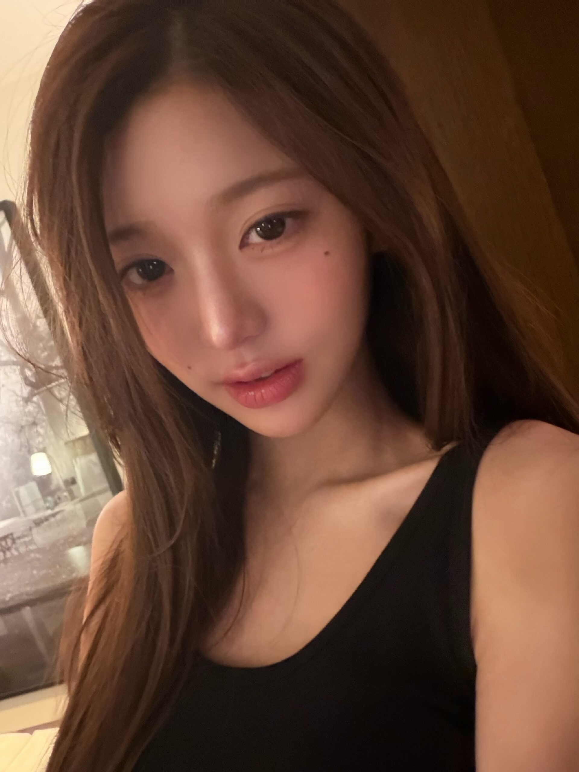 Jang Won-young Turns Up the Charm While Taking a Bed Selfie in a Black Dress