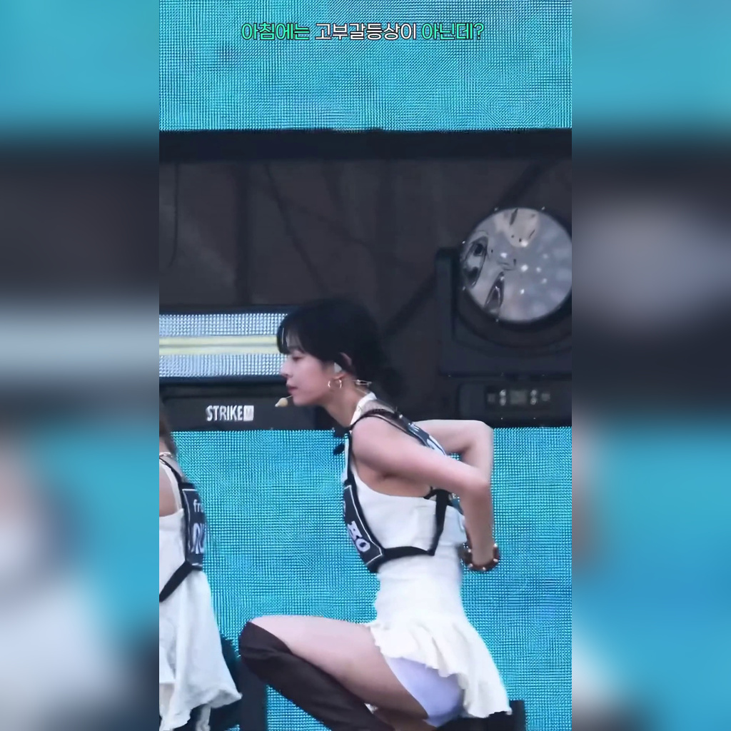 Lee Chae-young of fromis_9 in a rehearsal, black underwear showing under her white pants