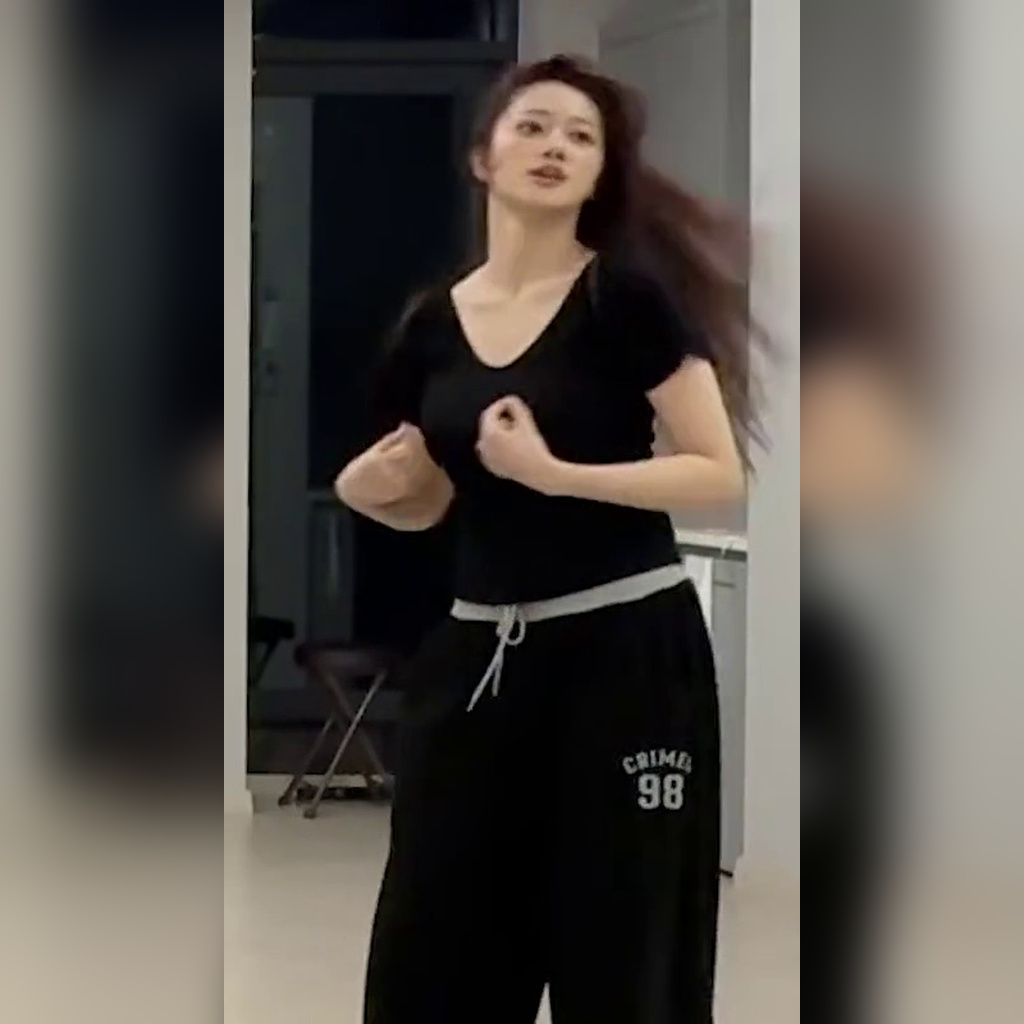 Class:y Wonjin in black short-sleeve top practicing choreography, bouncing chest area